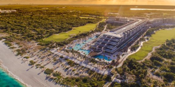 How far is Atelier Playa Mujeres from Cancun airport